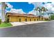 Attractive townhome exteriors with vibrant landscaping and garages, set against a sunny sky at 7315 River Hammock Dr # 101, Bradenton, FL 34212