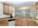 Kitchen features granite counters, stainless sink and light wood cabinetry at 7315 River Hammock Dr # 101, Bradenton, FL 34212
