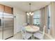 Bright breakfast nook with natural light and views of backyard at 7315 River Hammock Dr # 101, Bradenton, FL 34212
