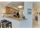 Modern kitchen features granite countertops, wooden cabinets and black appliances at 7315 River Hammock Dr # 101, Bradenton, FL 34212