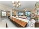 Bright living room featuring an extended dining table, stylish decor, and a view of the outdoor space at 7315 River Hammock Dr # 101, Bradenton, FL 34212