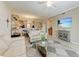 Bright living room with two sofas, stylish decor, and a seamless flow to the dining and kitchen areas at 7315 River Hammock Dr # 101, Bradenton, FL 34212