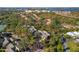 A beautiful aerial view showcases the community with lush trees and serene waterfront views at 754 Pine Run Dr # 754, Osprey, FL 34229