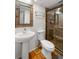 Updated bathroom with a pedestal sink and glass enclosed shower at 754 Pine Run Dr # 754, Osprey, FL 34229