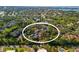 Wide aerial of the community nestled among the lush landscaping, waterfront, and surrounding neighborhood at 754 Pine Run Dr # 754, Osprey, FL 34229