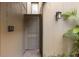 Exterior view of the property featuring a gated entrance and lush foliage at 754 Pine Run Dr # 754, Osprey, FL 34229