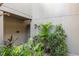 Exterior view with lush green foliage around the gated entrance at 754 Pine Run Dr # 754, Osprey, FL 34229