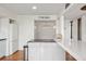 Bright kitchen featuring an island with countertop seating and stainless steel appliances at 754 Pine Run Dr # 754, Osprey, FL 34229