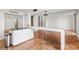 Bright room with terracotta tile, with kitchen access and bar stool seating near a 