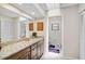 Bathroom has granite counters and access to the toilet and shower area at 7817 Pine Trace Dr # 15, Sarasota, FL 34243