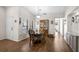 Dining room features natural light, hardwood flooring, and dining table set perfect for dinner parties at 7817 Pine Trace Dr # 15, Sarasota, FL 34243