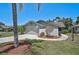 Charming single-story home with landscaped front yard, mature tree, attached garage and concrete driveway at 7817 Pine Trace Dr # 15, Sarasota, FL 34243