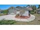 Charming home featuring a well-manicured front yard, a garage, and a decorative fence, creating an inviting curb appeal at 7817 Pine Trace Dr # 15, Sarasota, FL 34243