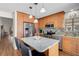 Contemporary kitchen features stainless steel appliances, granite counters and a center island at 7817 Pine Trace Dr # 15, Sarasota, FL 34243