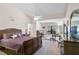 Spacious main bedroom has vaulted ceilings, fan, and an adjacent sitting area at 7817 Pine Trace Dr # 15, Sarasota, FL 34243