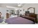 Comfortable main bedroom with a sitting area, desk, and view of backyard at 7817 Pine Trace Dr # 15, Sarasota, FL 34243