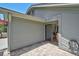 Exterior patio with pavers offers backyard access through a sliding glass door to the kitchen at 7817 Pine Trace Dr # 15, Sarasota, FL 34243