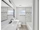 Bathroom with a soaking tub, and a wide marble countertop at 8304 Fishhawk Ave, New Port Richey, FL 34653