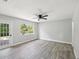 Spacious bedroom featuring new floors, neutral paint, and ample natural light at 8304 Fishhawk Ave, New Port Richey, FL 34653
