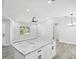 Kitchen island with granite countertop at 8304 Fishhawk Ave, New Port Richey, FL 34653