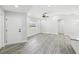 Open-concept living room with wood floors and recessed lighting at 8304 Fishhawk Ave, New Port Richey, FL 34653