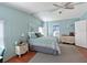 Calming bedroom with blue accents, a ceiling fan, and natural light at 8400 Princess Ct, Palmetto, FL 34221