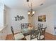 Dining room with modern table and chairs, unique wall art, and ample space at 8439 Imperial Cir, Palmetto, FL 34221