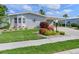Well-manicured lawn and landscaping highlight this home's exterior, complete with a covered carport at 8439 Imperial Cir, Palmetto, FL 34221