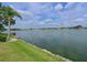 Enjoy serene lake views from this beautiful property, complete with lush greenery and a private dock at 8439 Imperial Cir, Palmetto, FL 34221