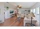 Spacious living area featuring wood floors, neutral tones, and ample natural light at 8439 Imperial Cir, Palmetto, FL 34221