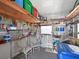 Organized storage room with shelving, tools, chairs, and various household items at 8439 Imperial Cir, Palmetto, FL 34221