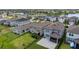 Aerial view showcasing the neighborhood's homes, a lake, and nearby community amenities at 11430 Gallatin Trl, Parrish, FL 34219