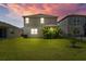 Well-maintained backyard with lush green grass and privacy landscaping at 11430 Gallatin Trl, Parrish, FL 34219