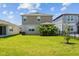 Well-maintained backyard with lush green grass and privacy landscaping at 11430 Gallatin Trl, Parrish, FL 34219