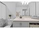 Well-lit bathroom featuring a shower-tub combo, patterned shower curtain, and spacious vanity with storage at 11430 Gallatin Trl, Parrish, FL 34219