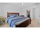 Relaxing bedroom features a comfortable bed, closet and doorway to adjacent room at 11430 Gallatin Trl, Parrish, FL 34219