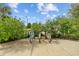 Bike rack with colorful bikes in a landscaped area with flowering bushes and trees at 11430 Gallatin Trl, Parrish, FL 34219
