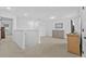A spacious bonus room has a carpet floor, white walls, and a television at 11430 Gallatin Trl, Parrish, FL 34219