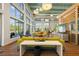 Stylish clubhouse featuring modern furniture, high ceilings, and large windows offering abundant natural light at 11430 Gallatin Trl, Parrish, FL 34219
