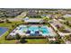 Stunning aerial view of a community pool surrounded by palm trees and lounge chairs, perfect for relaxation at 11430 Gallatin Trl, Parrish, FL 34219