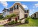 Charming two-story home features landscaped yard, brick driveway, and attached garage at 11430 Gallatin Trl, Parrish, FL 34219