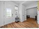 Bright foyer with tile flooring, coat closet, and sidelight window in the front door at 11430 Gallatin Trl, Parrish, FL 34219
