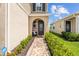 Welcoming front entryway with landscaped pathway and covered porch at 11430 Gallatin Trl, Parrish, FL 34219