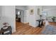 Hallway with hardwood floors leads to living areas at 11430 Gallatin Trl, Parrish, FL 34219