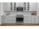 Modern kitchen features stainless steel oven, microwave, and stylish white cabinets at 11430 Gallatin Trl, Parrish, FL 34219