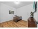 Office space features wood floors, a contemporary desk, and natural light at 11430 Gallatin Trl, Parrish, FL 34219