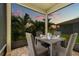 Covered patio seating area with wicker furniture and outdoor view at 11430 Gallatin Trl, Parrish, FL 34219
