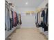 Spacious walk-in closet with ample hanging space and shelving for organized clothing and accessories at 11430 Gallatin Trl, Parrish, FL 34219