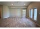 Large open living room featuring gray toned flooring, neutral paint and recessed lighting at 12089 Mayfair Ave, Port Charlotte, FL 33981