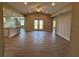 Open-concept living room featuring tile floors, vaulted ceiling, and bright and airy atmosphere at 12089 Mayfair Ave, Port Charlotte, FL 33981